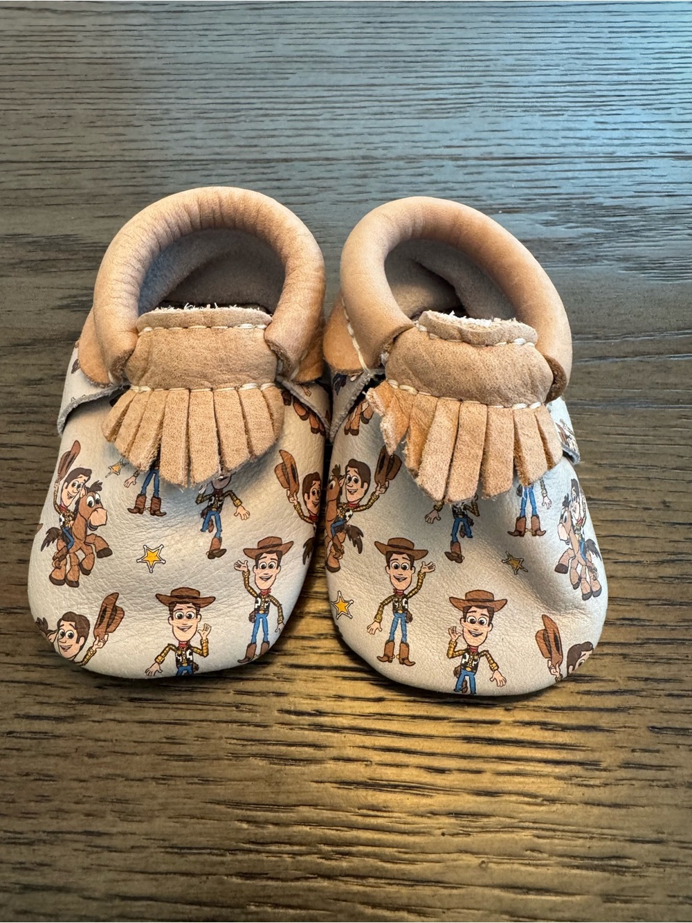 Freshly Picked Tan Moccasins with Cowboy Toy Story Print